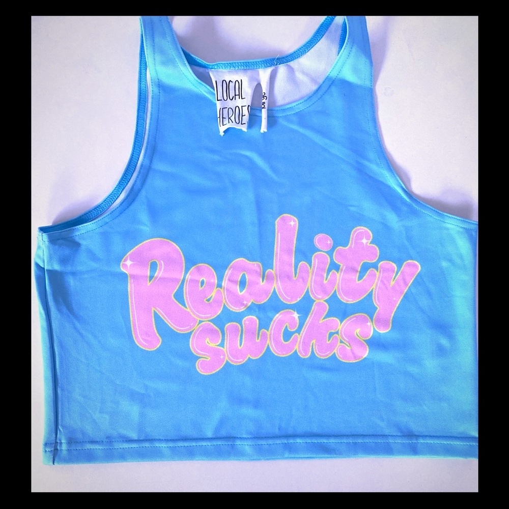 Reality Sucks light blue crop top